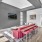 room with red couch and a tv 