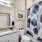 Large well lit bathroom with white accents 