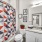 Large well lit bathroom with white accents 