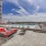 Large sparkling blue pool with a large pool deck and lounge chairs