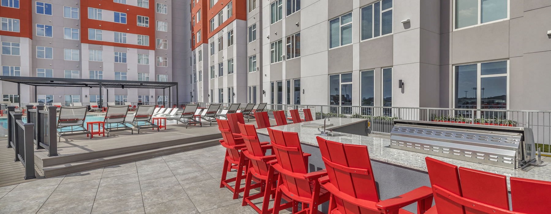red chairs around a grill