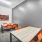 room with two tables and chairs 