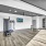large room with wood floors and large windows 
