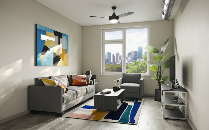 living room with colorful art, spacious seating and bright lighting